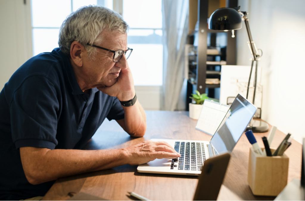 Person reviewing tax documents and retirement planning notes at a desk