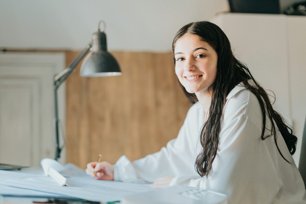 Recent college graduate reviewing financial plans and budgeting strategies while starting her professional career.